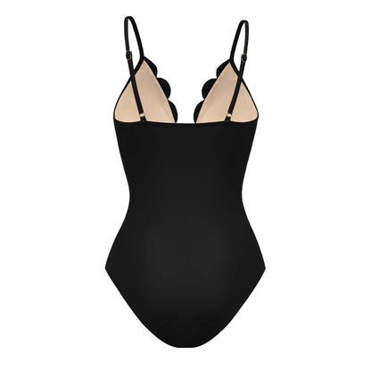 Maillot de bain une pièce noir à fleurs découpées au laser et détails ajourés, avec jupe assortie
