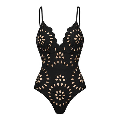 Maillot de bain une pièce noir à fleurs découpées au laser et détails ajourés, avec jupe assortie