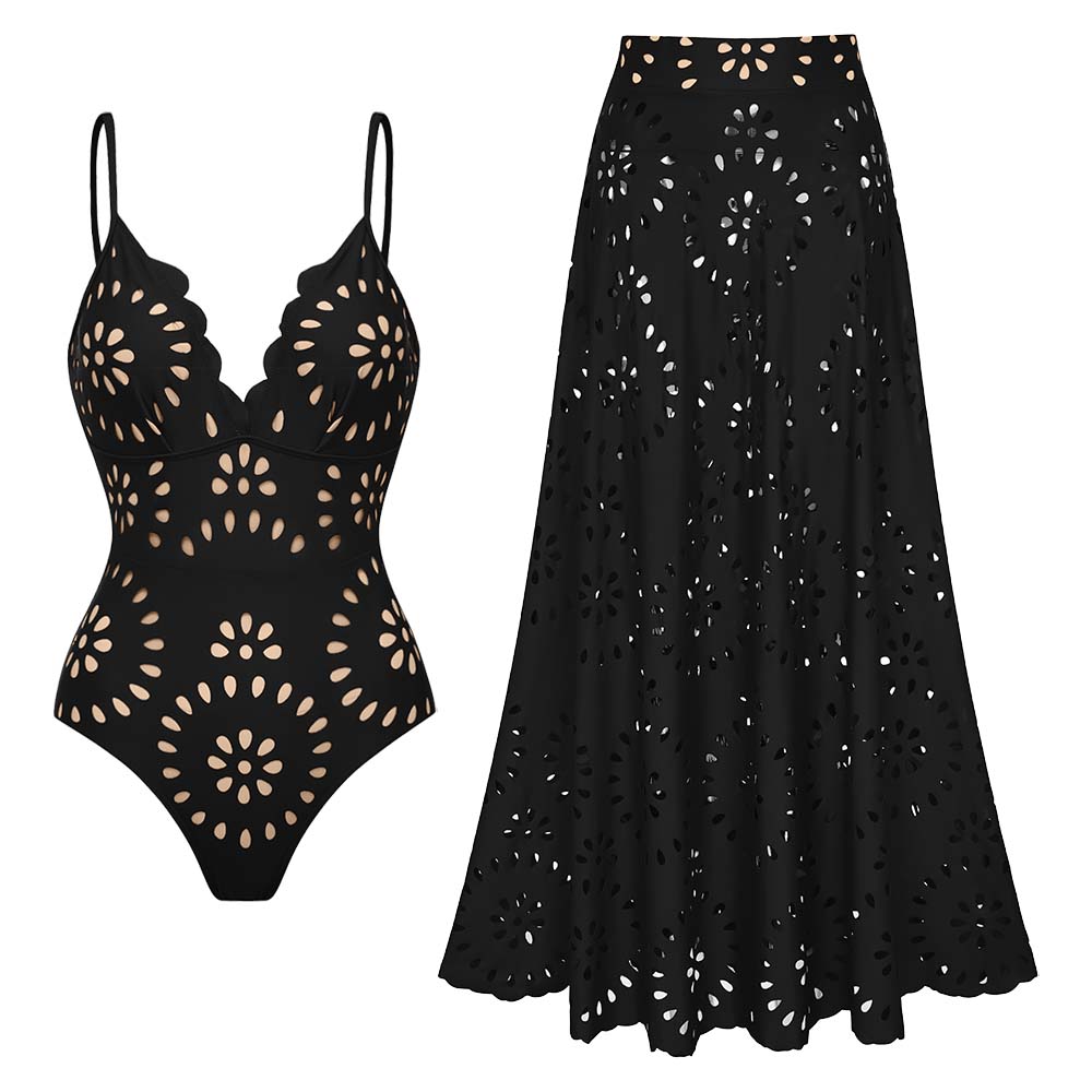 Maillot de bain une pièce noir à fleurs découpées au laser et détails ajourés, avec jupe assortie