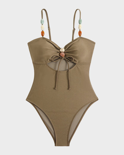 Maillot de bain élégant en satin avec perles décoratives et découpes tendance